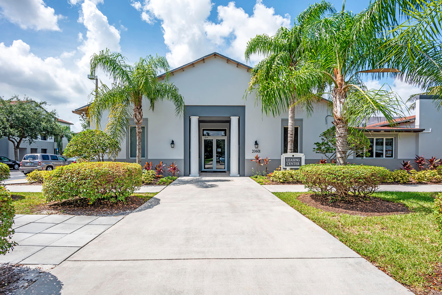The building exterior of the leasing center at the Cedar Grove Apartments in Miami, Florida.